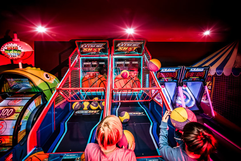 Kid playing arcade game