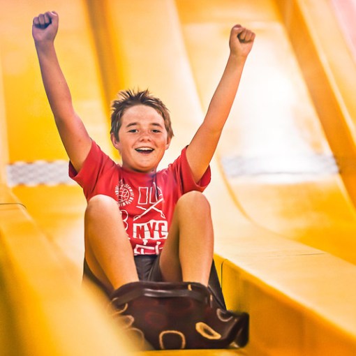 Kid enjoying the giant slide