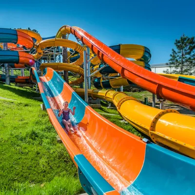 Young girl sliding on water park