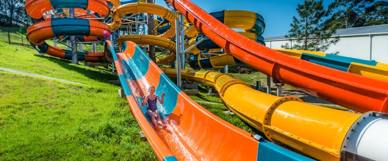 Young girl sliding on water park