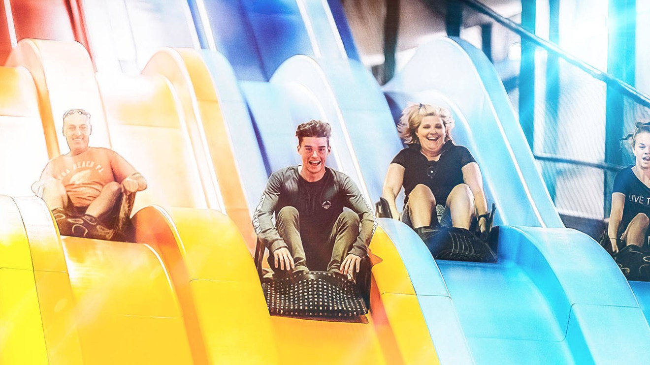 People playing on giant slide