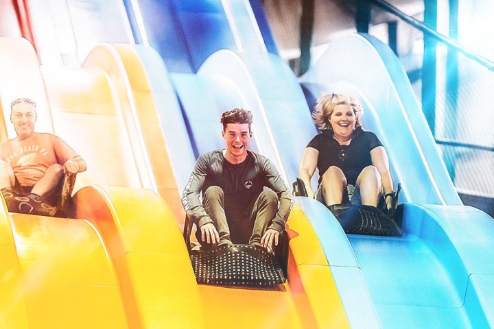People playing on giant slide