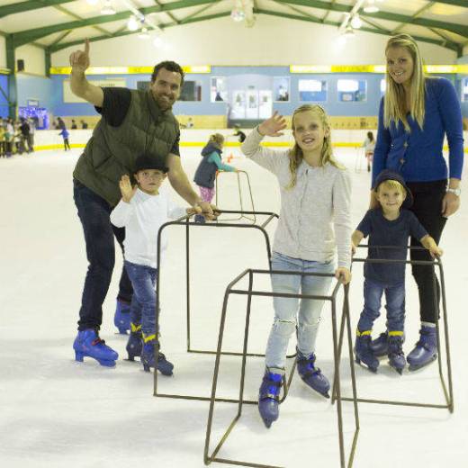 Family enjoying ice skating