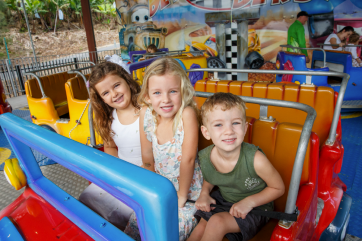 a boy and a girl sitting on a chair