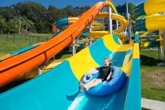 a boat sitting next to a pool of water