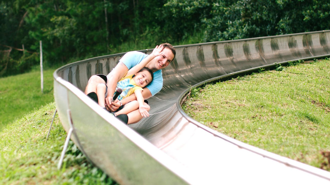 a person sitting on a bench in a park