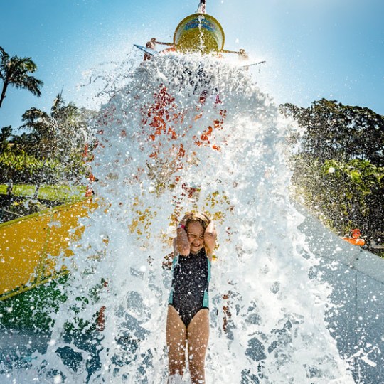 a man riding a wave on a surfboard in the water