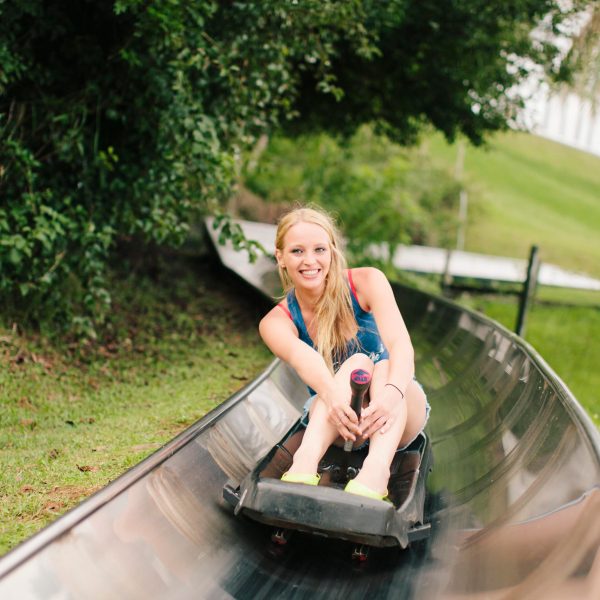 a woman sitting on a skateboard