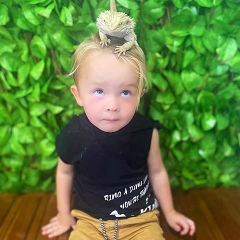 a little girl standing in front of it