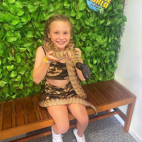 a small child sitting on a table