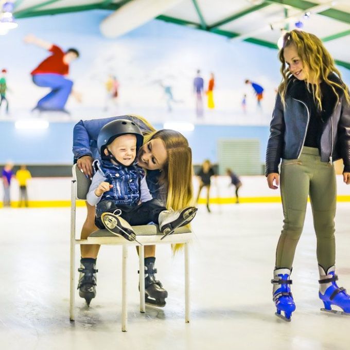 a woman standing next to a suitcase