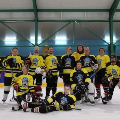 a group of hockey players posing for a picture