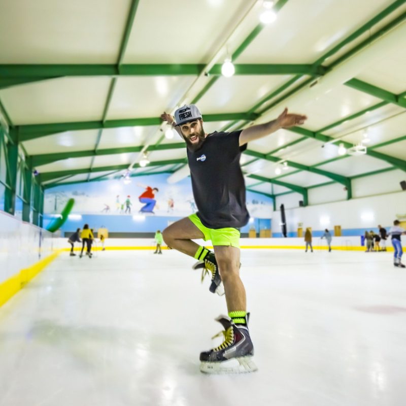 a man riding a skateboard up the side of a building
