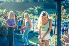 a group of people standing next to a woman