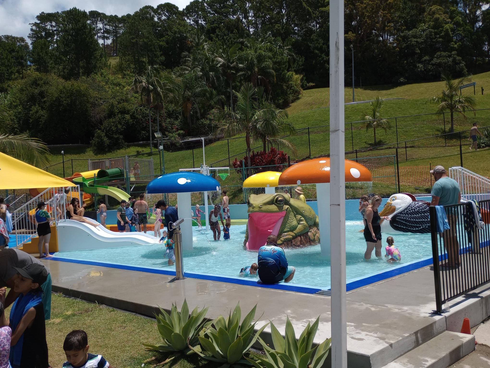 a group of people sitting at a park