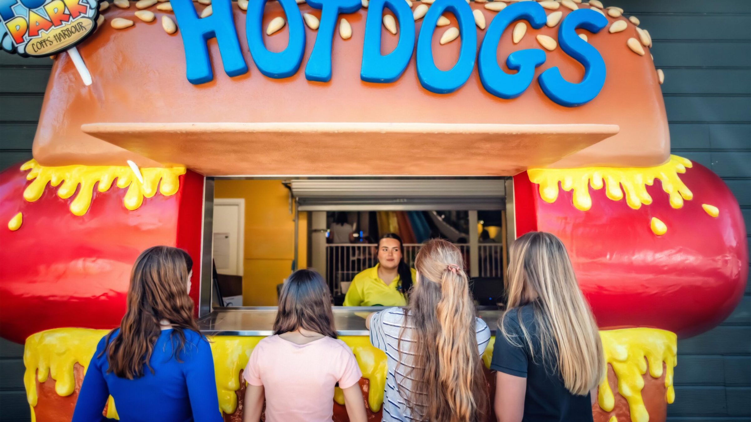 a woman standing in front of a bus