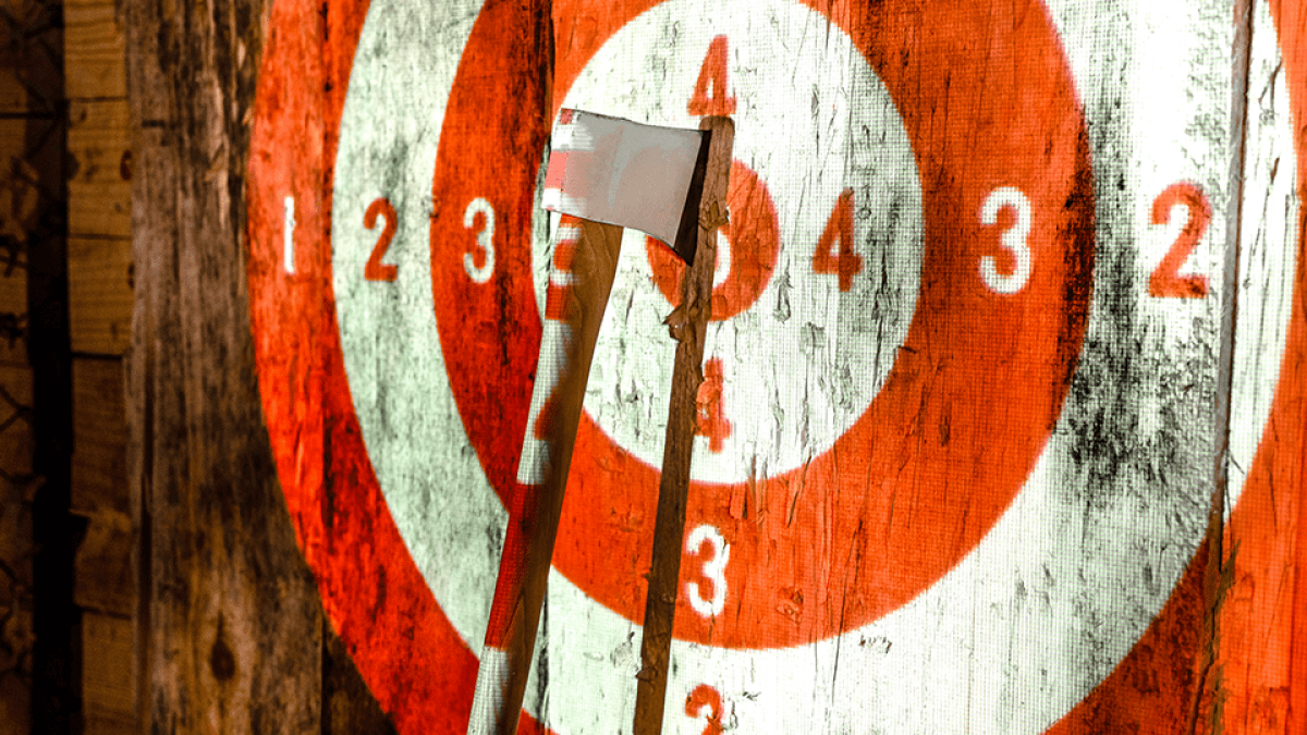 a close up of a stop sign is covered with graffiti