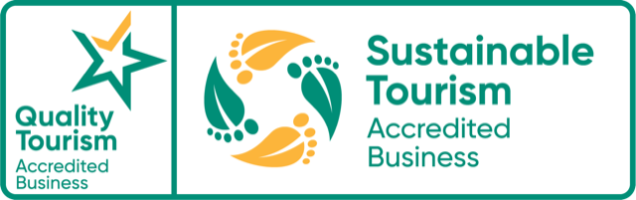 Quality and Sustainable Tourism Accredited Business logos with star and leaf-foot circle design.