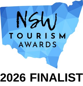 Logo for NSW Tourism Awards 2026 Finalist over blue map design.